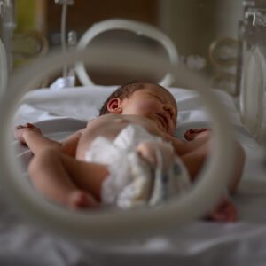 Newborn baby in incubator