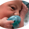Newborn baby with a pacifier resting peacefully.